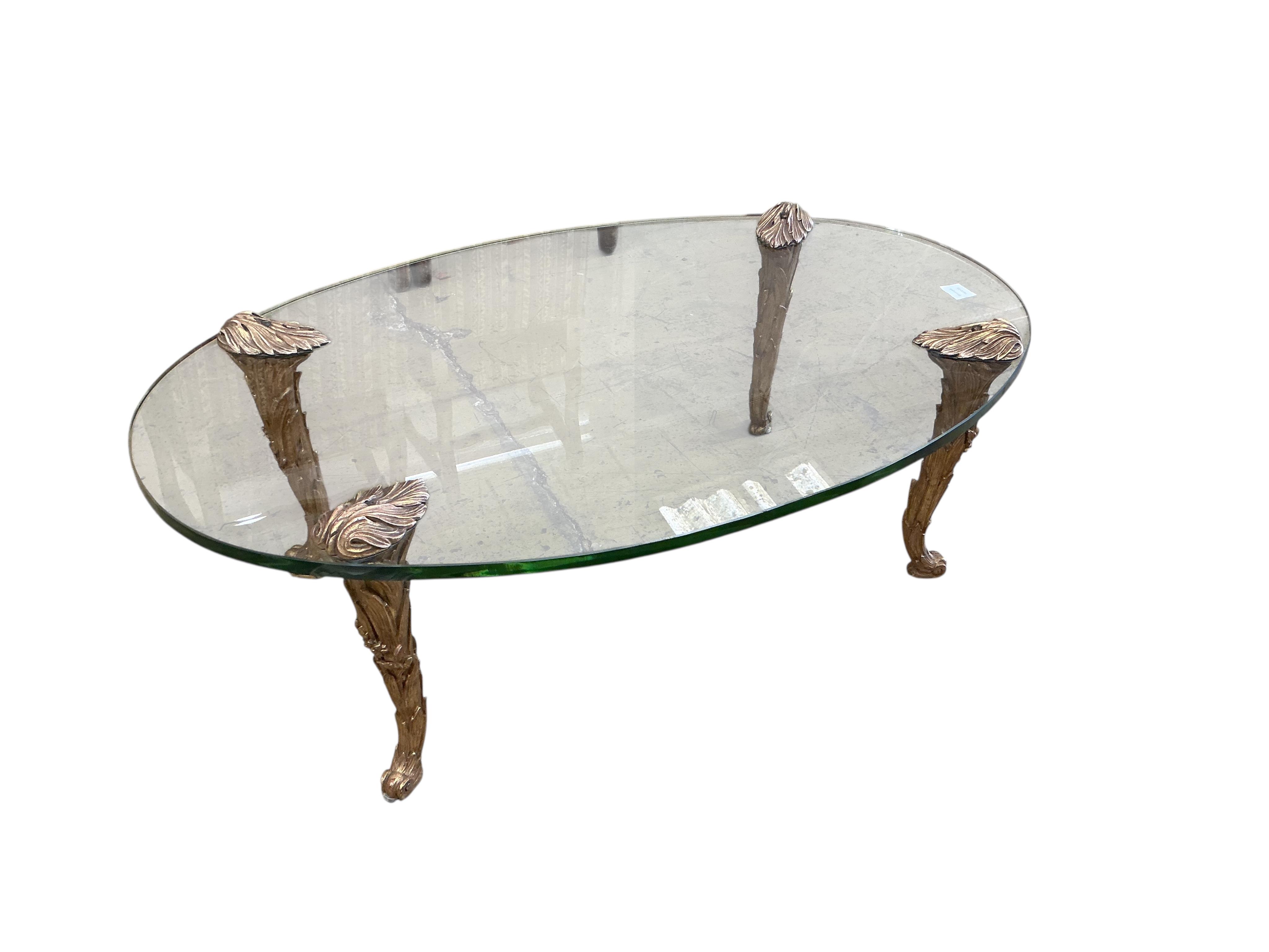 A Contemporary oval glass topped coffee table on giltwood legs, width 114cm, depth 72cm, height 38cm